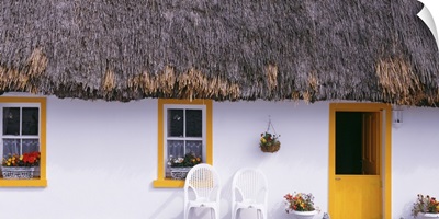Two chairs outside a cottage, County Clare, Republic Of Ireland