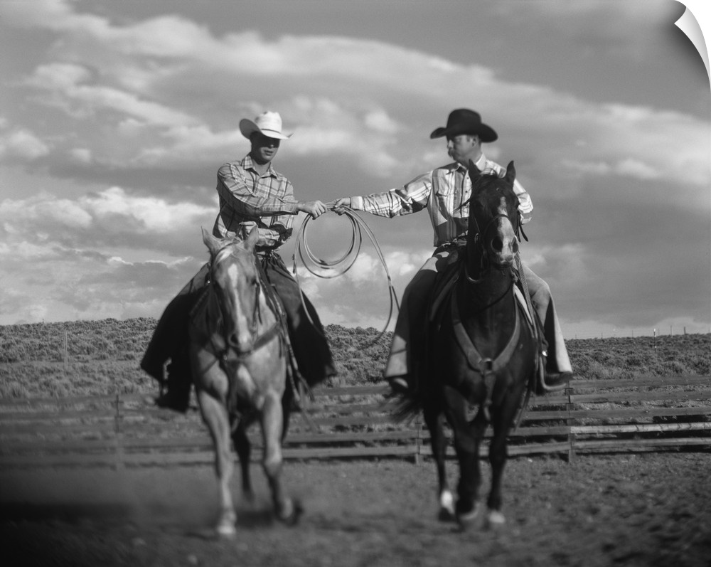 Two Cowboys on Horseback