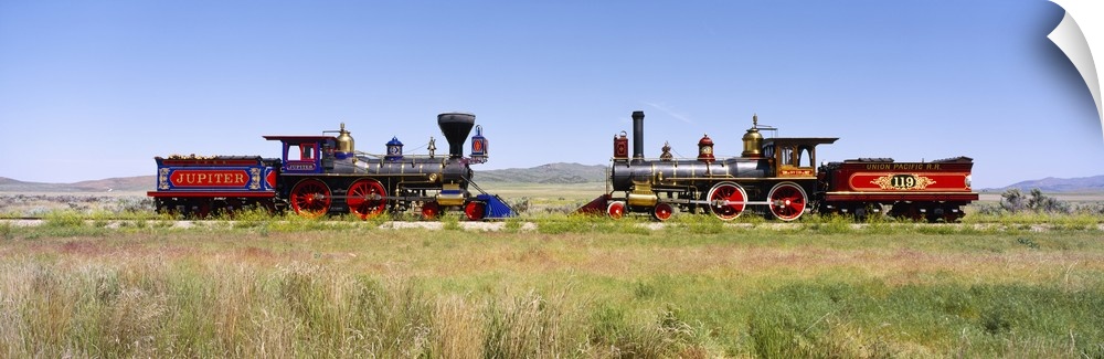 Two restored trains facing one another on opposite rails at Promontory Summit in Utah.