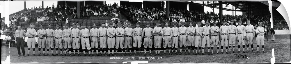 Giant, horizontal photograph of the 1913 Washington baseball team standing in front of bleachers that are partially full o...