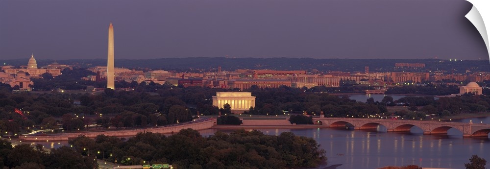 Wide angle, aerial photograph of Washington DC at night, including the Washington Monument, the Capitol Building and the L...