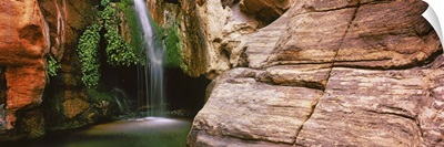 Waterfall rushing through Redwall Cavern, Grand Canyon National Park, Arizona