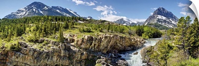 Waterfalls at base of a lake, Swiftcurrent Lake, Glacier National Park, Montana