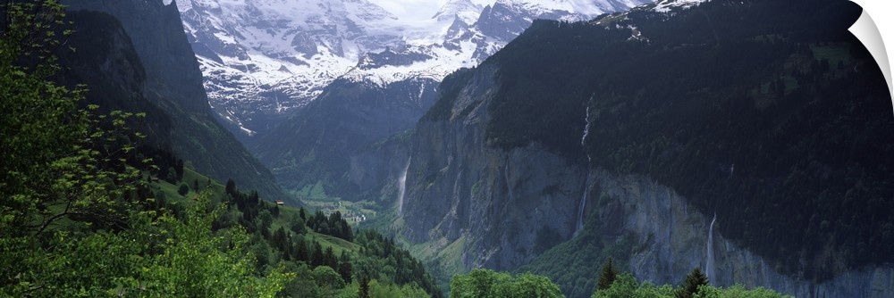 Waterfalls in a forest Lauterbrunnen Valley Wengen Bernese Oberland Berne Canton Switzerland