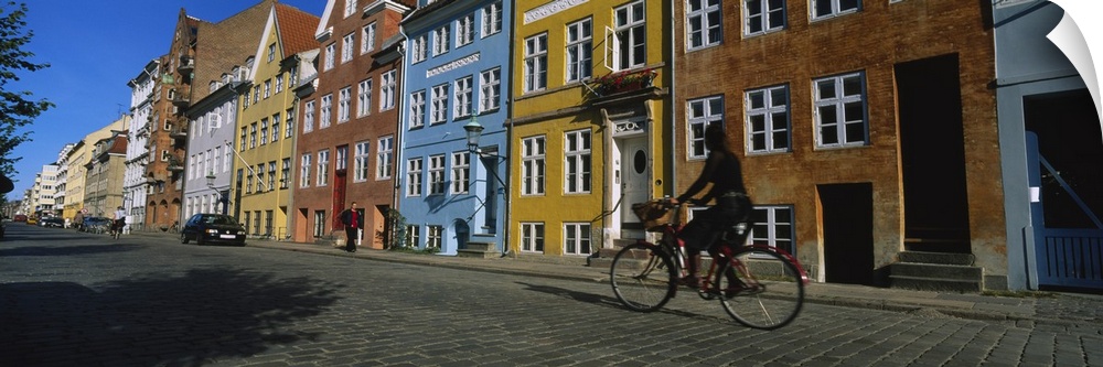 Woman riding a bicycle, Copenhagen, Denmark