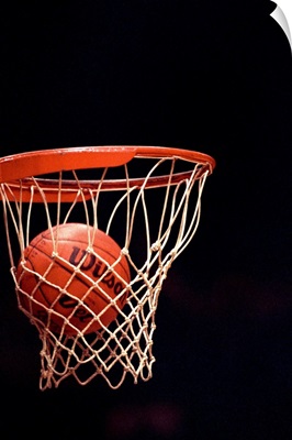 Basketball going through the hoop
