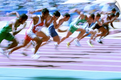 Blurred action at the start of a mens 100 meter track and field race