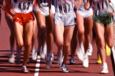 Blurred action of women runners during a track race