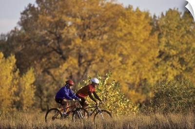 Couple mountain biking in Fall