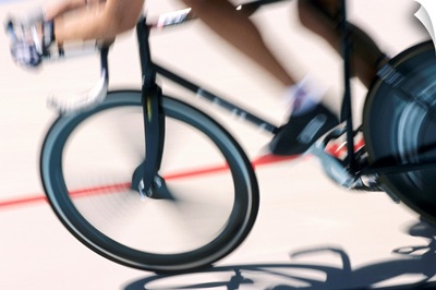Detail of blurred action of cyclist competing on the velodrome