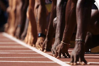 Detail of hands at the start of 100m race