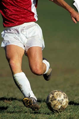 Detail of male soccer player with the ball