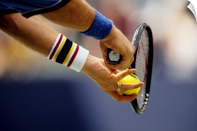 Detail of the hands of tennis player about to serve