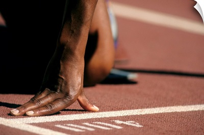 Detail of woman's hand at the start of 400m race