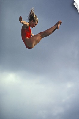 Female diver flying through the air
