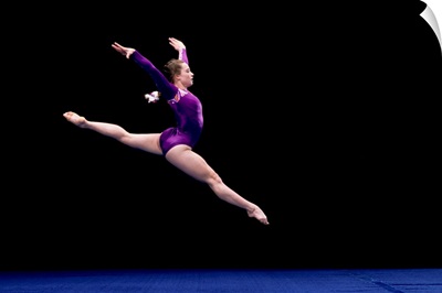Female gymnast performing on the floor exercise
