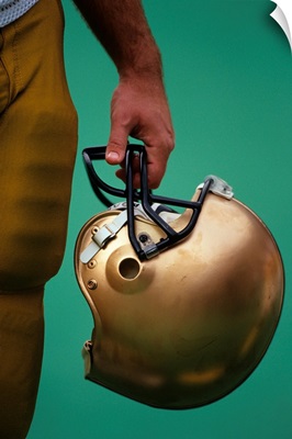Football player holding his helmet