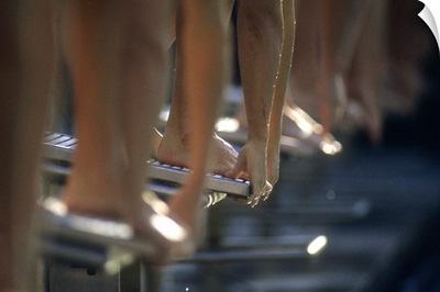 Male swimmers at the start of a race