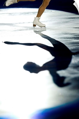 Shadow of female figure skater in action