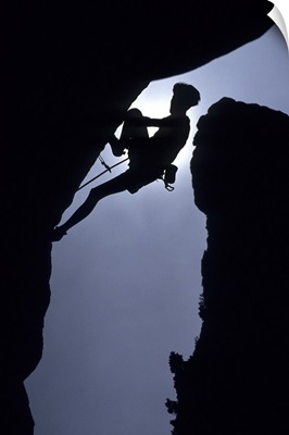 Silhouette of male rock climber