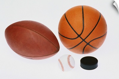 Sports equipment: football, baseball, basketball, hockey puck,