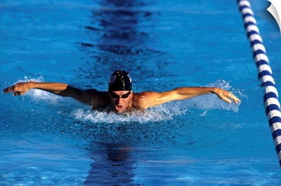 Swimmer competing in a butterfly race