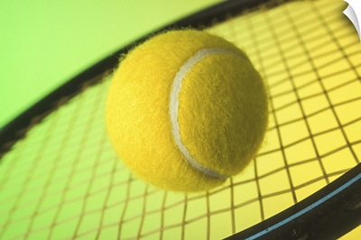 Tennis ball on racquet