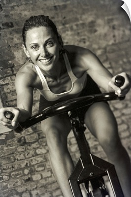 Woman exercising on a stationary bike.
