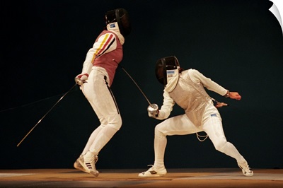 Women fencers in action