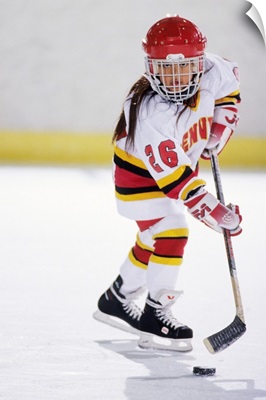 Young girl playing ice hockey