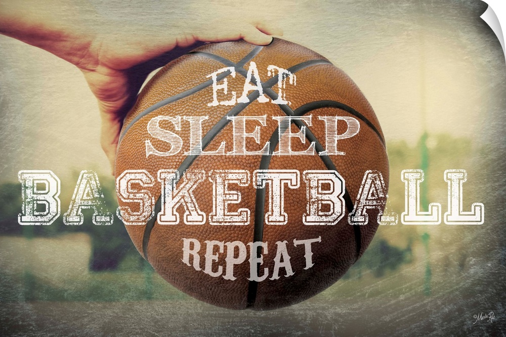 A basketball typography design with a hand holding a ball.