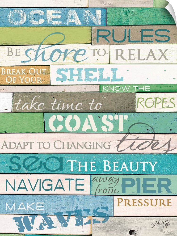 Typography home decor art, with text in different fonts against a colorful wooden surface.