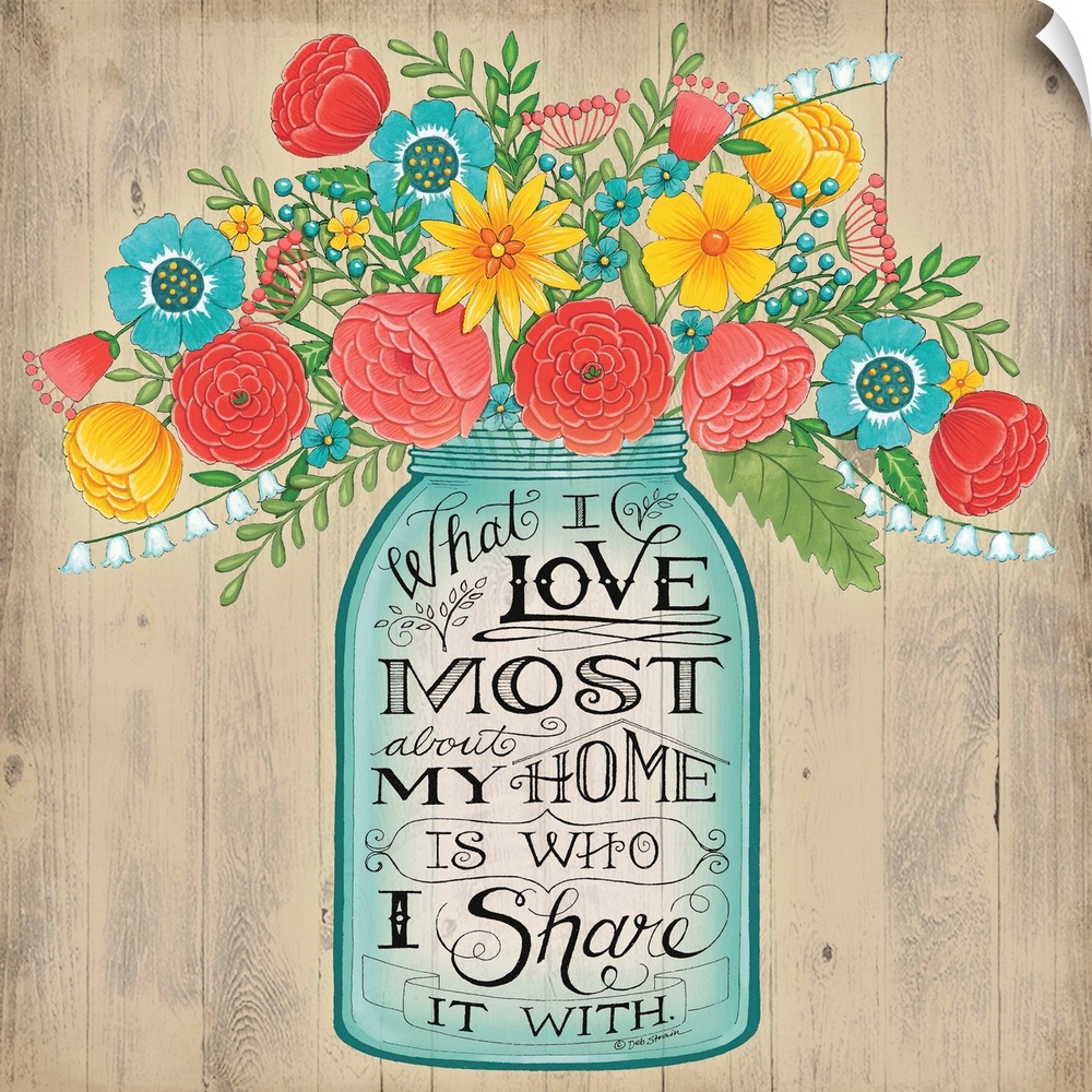 A bouquet of colorful flowers in a mason jar with decorative lettering.