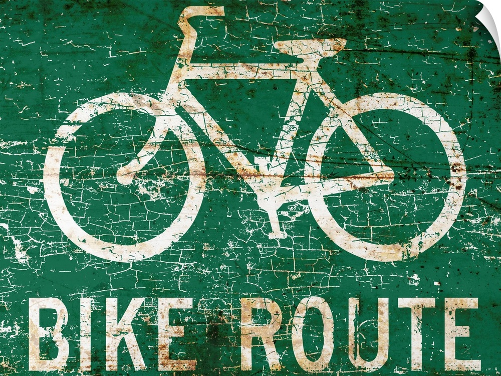 A worn, distressed, cracked and rusty bike route street sign.