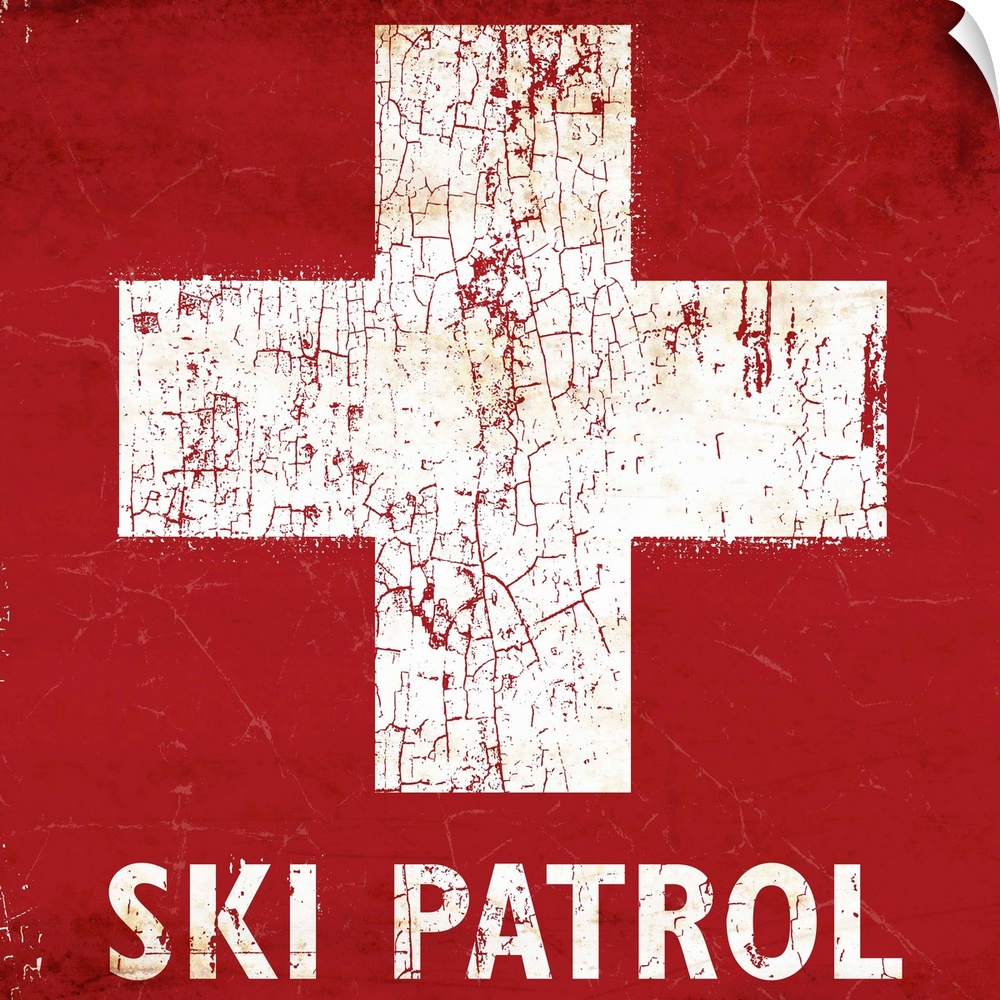 A worn, distressed, cracked and rusty Ski Patrol ski sign.