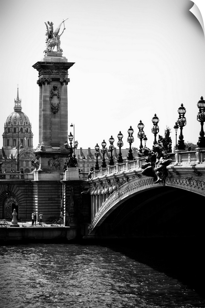 A black and white photograph of the Alexandre III bridge in Paris.