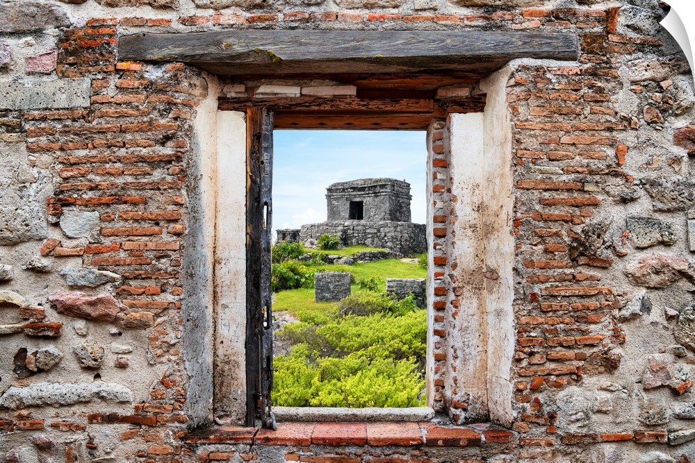 View of the ancient Mayan fortress in Tulum, Mexico, framed through a stony, brick window. From the Viva Mexico Window View.