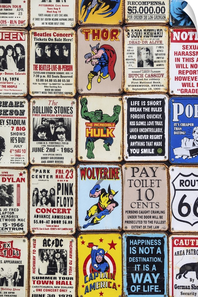 Souvenir metal signs for sale in London, featuring superheroes, sarcastic sayings, and popular music artists.