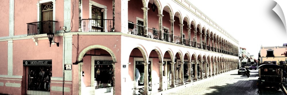 Washed out panoramic photograph of a streetscape in Campeche, Mexico, with pink architecture. From the Viva Mexico Panoram...