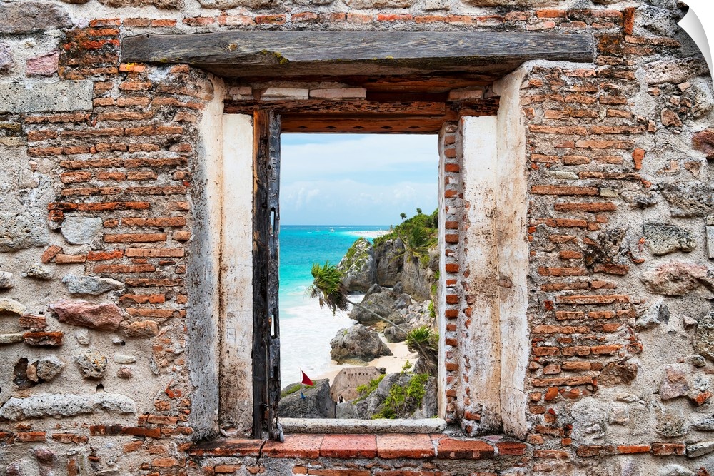 View of the Caribbean coastline in Tulum, Mexico, framed through a stony, brick window. From the Viva Mexico Window View.