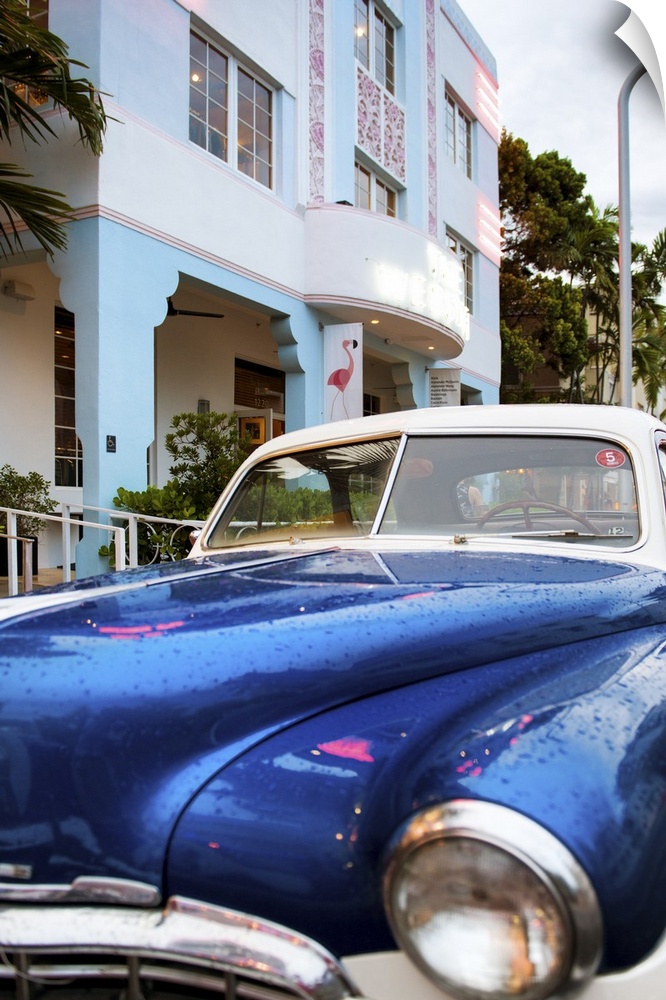Photograph of a classic car in Miami, Florida, by an art deco style building.
