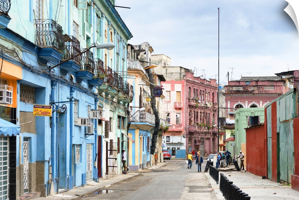 Photograph of a streetscape in Havana, Cuba, highlighting the colorful architecture.