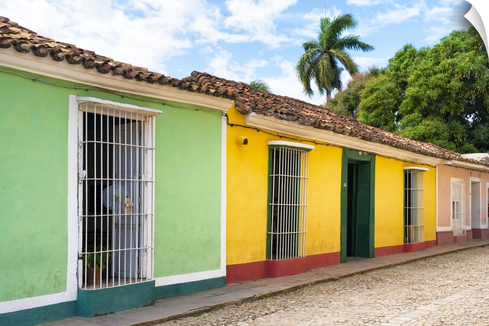 Photograph of colorful facades lining a Trinidad streetscape.