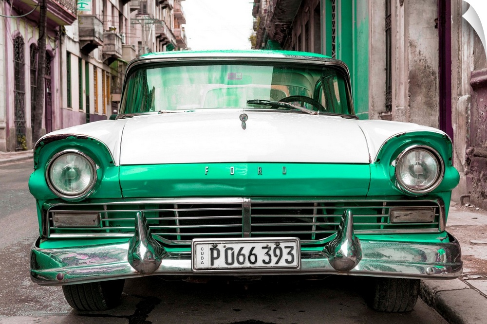 Photograph of a vintage green and white Ford parked in downtown Havana.