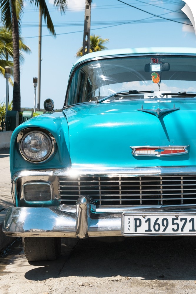 Photograph of a turquoise vintage Chevy taxi in Havana, Cuba