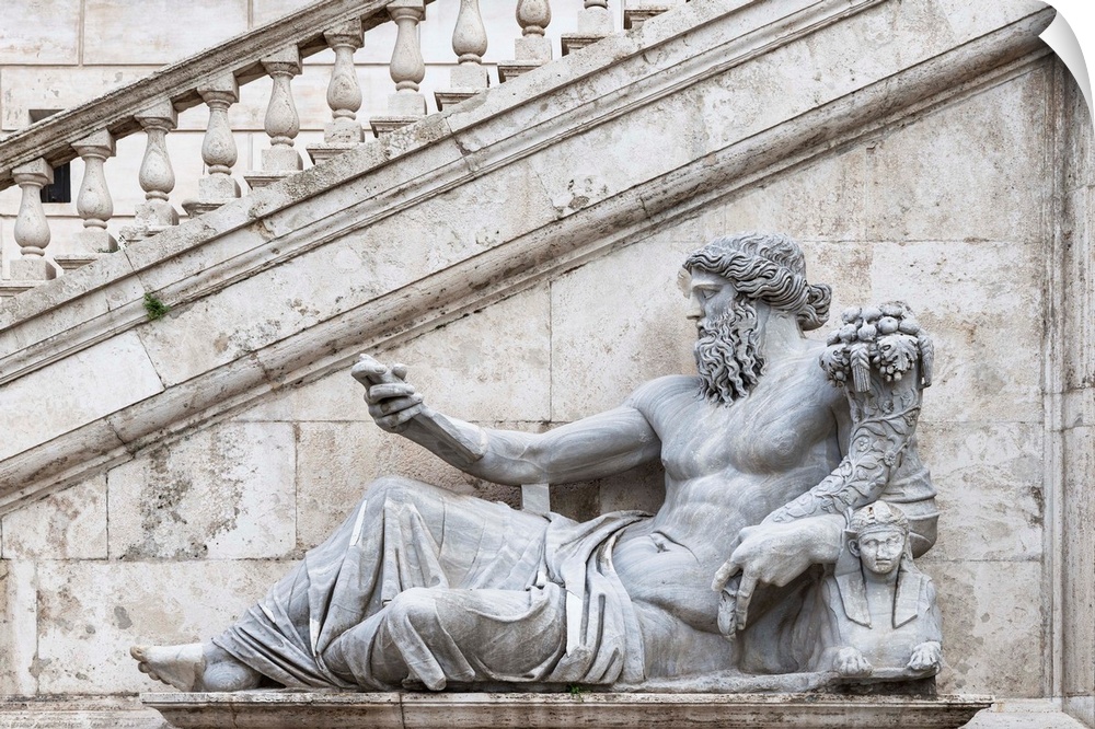 It's a ancient roman sculpture of the personification of the Tiber river in the Piazza del Campidoglio of Rome, Italy.