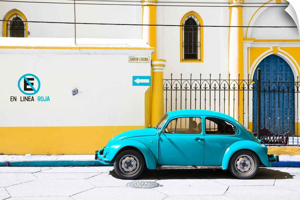 Photograph of a Volkswagen Beetle parked in front of a yellow and white building. From the Viva Mexico Collection.