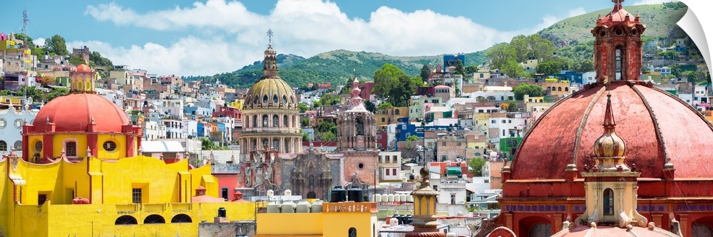 Panoramic photograph of a cityscape in Guanajuato, Mexico, with colorful buildings and church domes. From the Viva Mexico ...