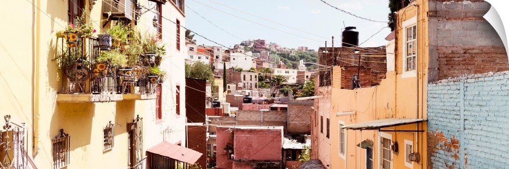 Panoramic photograph of rows of colorful houses in Guanajuato, Mexico. From the Viva Mexico Panoramic Collection.