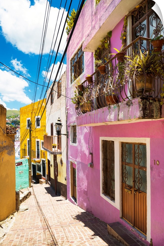 Vertical photograph of a colorful streetscape in Guanajuato. From the Viva Mexico Collection.